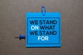 We Stand On What We Stand For write on sticky notes isolated on Office Desk
