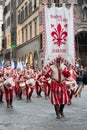 Standard bearer and drummer parades through the streets of Florence