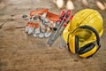 Standard construction safety equipment on wooden table Royalty Free Stock Photo