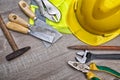 Standard construction safety equipment on wooden table. top view Royalty Free Stock Photo