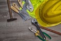 Standard construction safety equipment on wooden table. top view Royalty Free Stock Photo