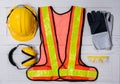 Standard construction safety equipment on wooden table. top view