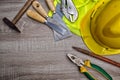 Standard construction safety equipment on wooden table. top view Royalty Free Stock Photo