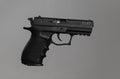 Standard handgun on light grey background. Semi-automatic pistol