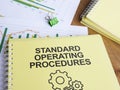 Standard operating procedures SOPs - detailed step-by-step instructions that guide employees through routine tasks Royalty Free Stock Photo