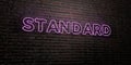 STANDARD -Realistic Neon Sign on Brick Wall background - 3D rendered royalty free stock image