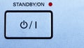 Standby-button in blue-grey with a grainy texture