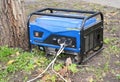 Standby Generator - Outdoor Power Equipment. Portable Generator on the House Construction Site. Royalty Free Stock Photo