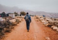 Traveler Walking in front of rural landscape in Taroudant Morocco. Royalty Free Stock Photo