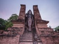 Standing ancient Sukhothai Buddha at dusk Royalty Free Stock Photo