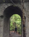 Standing at the arched entrance way to Rivendell Royalty Free Stock Photo