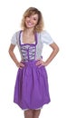 Standing bavarian woman with curly blonde hair