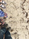 Standing on beach sand sandals