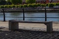 A standing bench in the shade among the trees on a walking route along the River Liffey Royalty Free Stock Photo