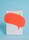 Standing blank spiral notepad speech bubble arrow banners above lying cool pastel retro background. Empty text important