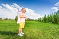 Standing boy wears paper rocket toy on shoulders Royalty Free Stock Photo