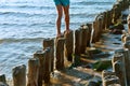 Person walking on sea breakwater Royalty Free Stock Photo