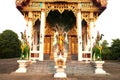 Standing Buddha front of Church on Thai temple in Thailand.