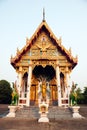 Standing Buddha front of Church on Thai temple in Thailand.