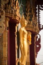 Standing Buddha front of Church on Thai temple in Thailand.