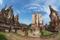 Standing Buddha statue at the ruins of the Wat Mahathat temple in Sukhothai Historical Park, Thailand. Royalty Free Stock Photo