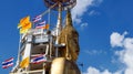 Standing Buddha travelling through Thailand with Backpack