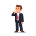 Standing business man making thinking gesture