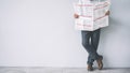 Standing businessman reading the newspaper