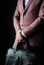 Standing Businessman in Suit with Leather Bag