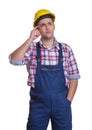 Standing construction worker thinking about the project Royalty Free Stock Photo