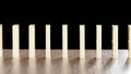 Standing domino stones on the table Royalty Free Stock Photo