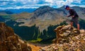 Standing on Edge of Rocky Mountains Exploration Hiking Terrain