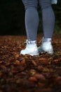 Standig on fallen leafs with boots autum vibes