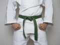 Standing fighter green belt centered martial arts