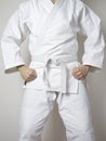 Standing fighter white belt martial arts white suit Royalty Free Stock Photo