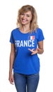 Standing french sports with blond hair and blue jersey Royalty Free Stock Photo