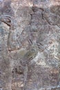 Standing Genie - ancient relief slab from a wall from the palace