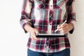 Standing girl writing on a tablet pc