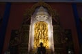 Standing golden Buddha at Sacred Hall in Wat Tha Mai temple.