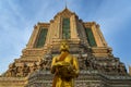 Standing golden Buddha sculpture in Temple of Dawn, Bangkok, Thailand Royalty Free Stock Photo