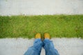 Standing on the grass and cement path