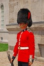 Standing guard in red uniform at Parliament Hill, Ottawa, Canada