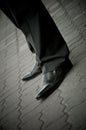 Standing imposing man in a patent leather shoes. legs only Royalty Free Stock Photo
