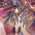 Standing near festive Christmas tree