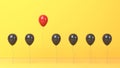 Standing out from the crowd and different concept, red and black balloon on yellow background Royalty Free Stock Photo