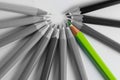 Standing out green pencil out of grey pencils Royalty Free Stock Photo