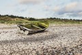 Standing on the shore, a lone boat