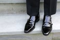 The polished black shoes look shiny and bright. Royalty Free Stock Photo