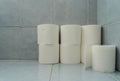 Standing toilet paper. Extra rolls on a blue tiled floor in house bathroom wall clean hygienic home compact short tall background