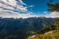 Standing on top of the mountain Planina Blato in the Triglav National Park in Slovenia with panoramic view over to the mountain